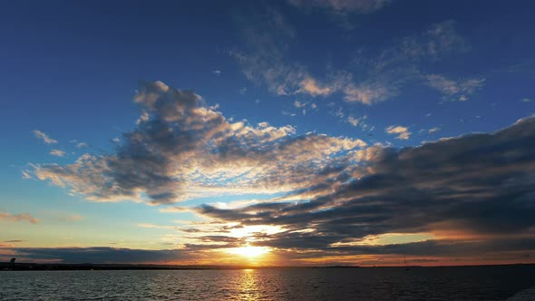 Beautiful Sunset with Clouds and Sea with Beach Time Lapse