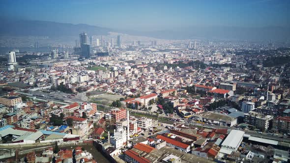 Drone view on poverty slum district and muslim mosque