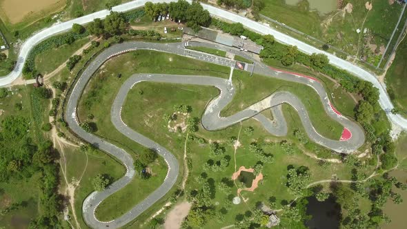 Faraway aerial view of a group driving kart on a speedway, Cambodia.