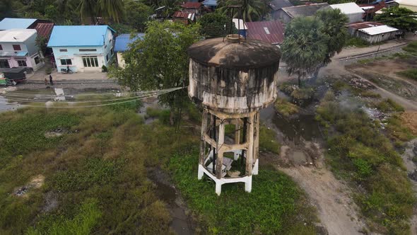 Aerial view of an old water tank in disuse in Battambang, Cambodia.