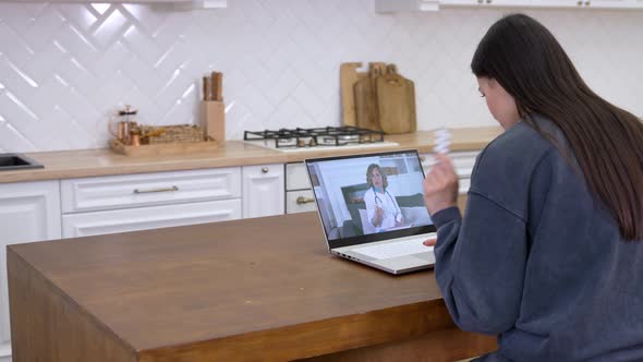 Female Doctor Talking with Patient Through Video Call