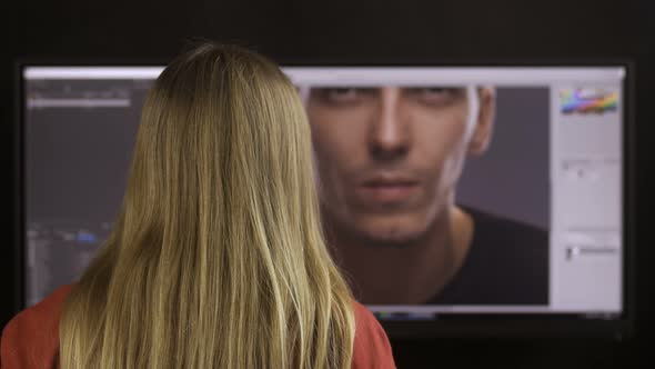 Back View of Female Retouching Specialist Working