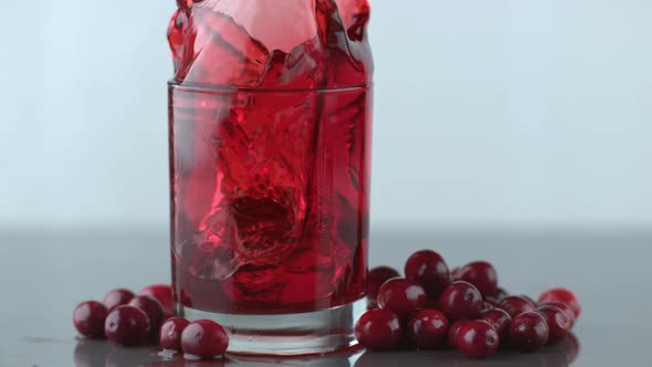 Ice splashing into cranberry juice in slow motion; shot on Phantom Flex 4K at 1000 fps alt