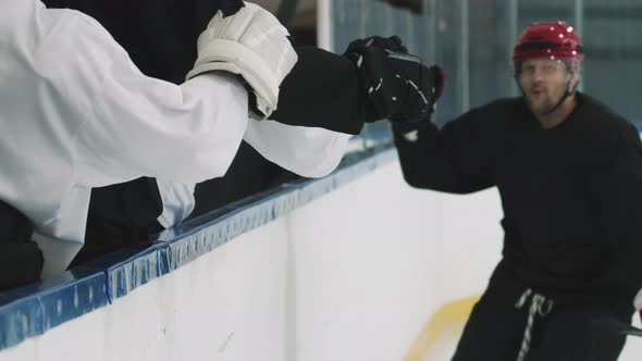 Hockey Player Giving High Fives To Team Members