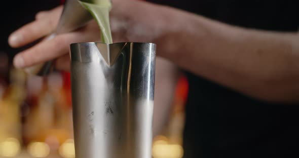 Barman Pours Portion of Alcohol From Jigger to the Shaker in Slow Motion Making the Cocktail at the