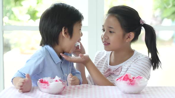 Happy Little Asian Children  Eating Ice Cream At Home