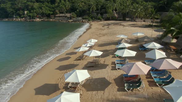 Lounge Chairs And Parasols On Tropical Beach Of Yelapa In Jalisco, Mexico. Aerial Drone Shot
