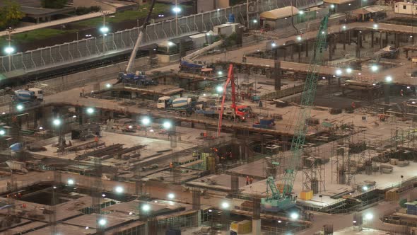 Time lapse of construction site with heavy construction machinery in metropolis