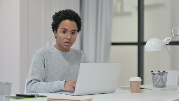 African Woman Feeling Shocked While Using Laptop 