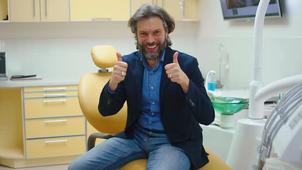 Handsome Patient Man on the Dentist Chair After