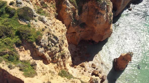 Top view of eroded cliff scarps coastline in Ponta da Piedade, Lagos, Algarve, Portugal