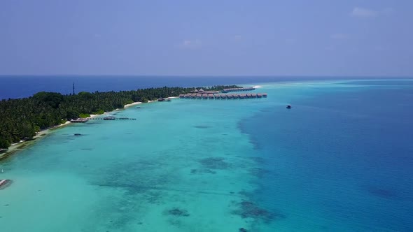 Aerial drone scenery of exotic coastline beach by blue ocean and sand background