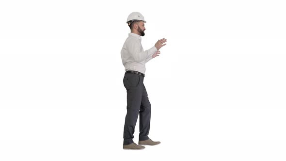 Engineer in Hardhat Walking and Explaining Something on White Background