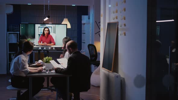 Multi Ethnic Team Overworking in Company Office Room Having Online Videocall Conference