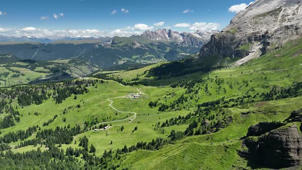 Dolomites mountains peaks with a hiking path on a summer day