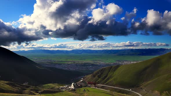 Time lapse city view from ski resort in spring