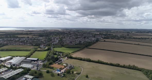 Aerial push in towards Tollesbury Town from the marina