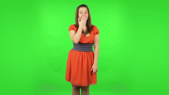 Cute Girl Is Smiling and Blowing Kiss. Green Screen