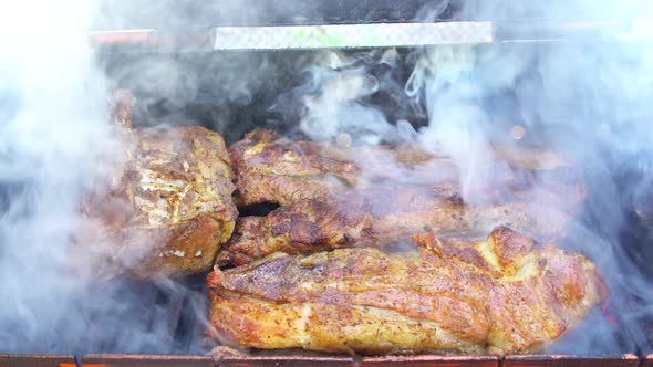 Grilled Pork Ribs on the Grill Wrapped Grilled on Charcoal Grill Braised Coals and Light Smoke