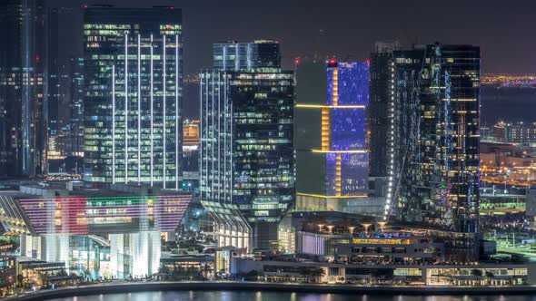 Aerial Skyline of Abu Dhabi City Centre From Above Night Timelapse