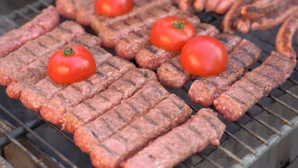 Grilled Sausage with the Addition Vegetables on the Grill Plate