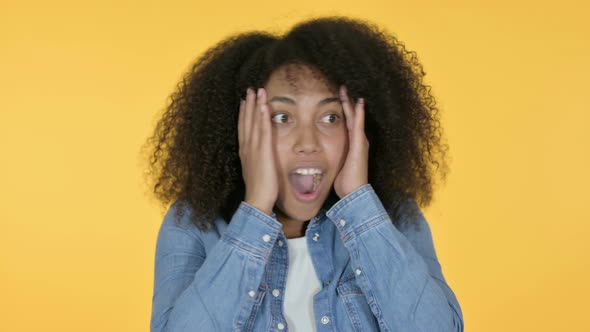 African Woman Having Loss, Yellow Background 