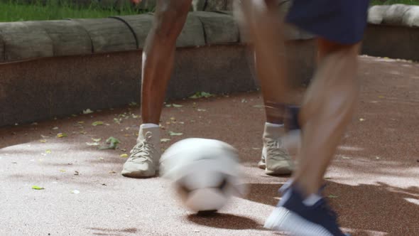Two Unrecognizable African American Guys Playing Soccer Outdoors Cropped