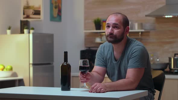 Lonely Husband Drinking a Glass of Wine