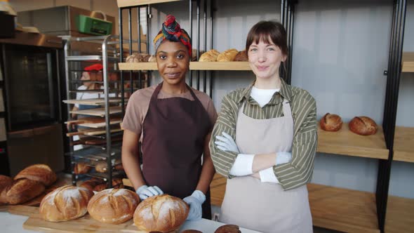 Portrait of Cheerful Multiethnic Female Bakers at Work