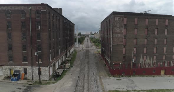 Aerial in between two warehouse in downtown St. Louis by the Mississippi River