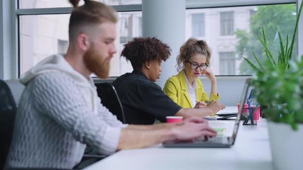 Startup Team Discussing New Project in Office