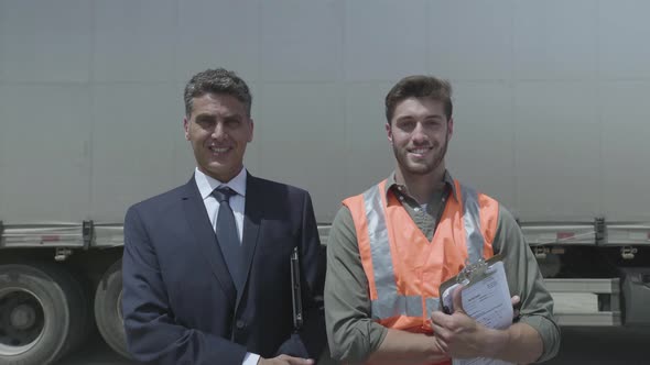 Worker and businessman smiling