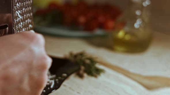 Grated Cheese on a Table Full of Vegetables