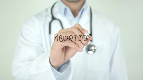 Abortion, Doctor Writing on Transparent Screen