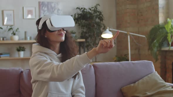 Woman in VR Headset Using Invisible Touchscreen