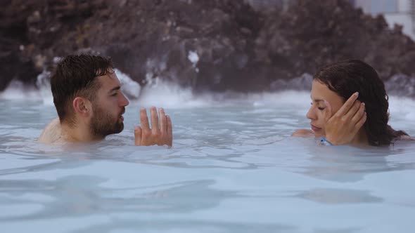 Couple Relaxing In Lagoon Geothermal Spa