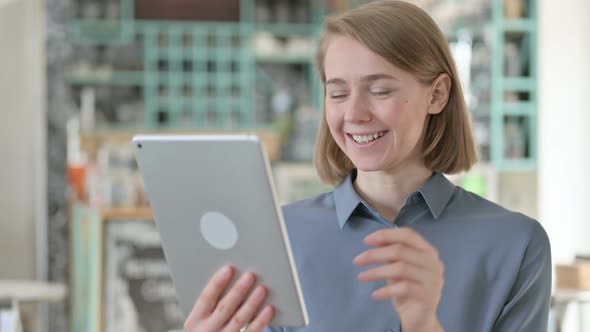 Portrait of Young Woman Talking on Video Call on Tablet