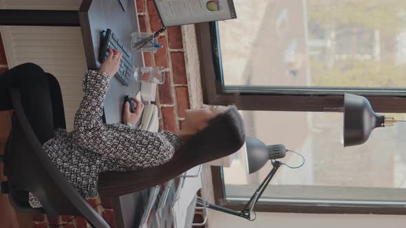 Vertical Video Satisfied Woman Celebrating Business Achievement on Computer