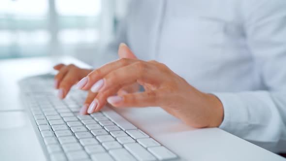 Female Hands Typing on a Computer Keyboard. Concept of Remote Work