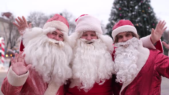 Three Funny Old Bearded Santa Claus Welcome the New Year They Wave Their Hands Hi