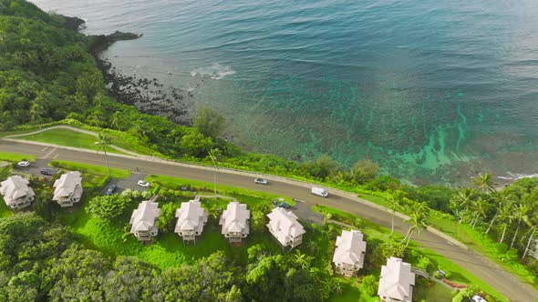 Cinematic Ocean Shore Shot Cars with Tourists Driving to Summer Beach Rentals