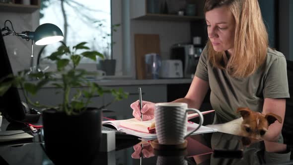 Tired Woman Works Remotely at Computer