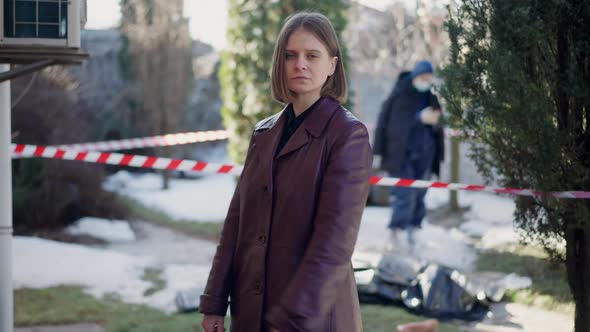 Portrait of Confident Caucasian Woman Crossing Hands Looking at Camera with Serious Facial