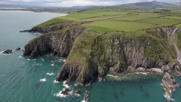 Drone shot of large sea cliffs on the Irish coastline.