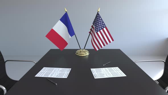 Flags of France and the United States of America and Papers