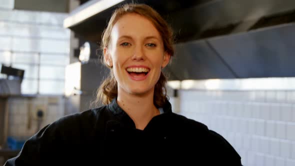 Female chef standing in the commercial kitchen 4k