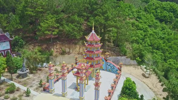 Drone Rotates Above Pagoda in Buddhist Temple Complex