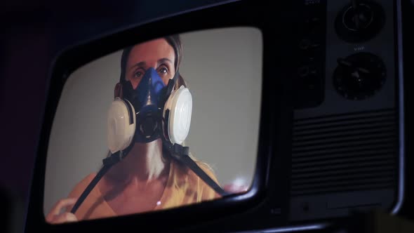 Woman with Face Mask on a Retro Television.