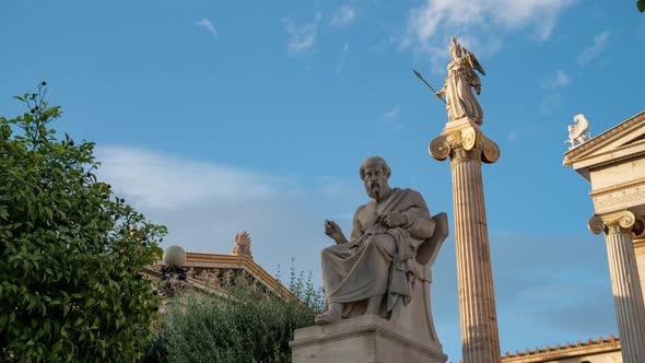 Statues of Plato and Athena time lapse in Academy of Athens during sunset