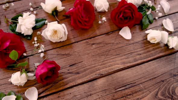 Copy space between flowers on a wooden table close up